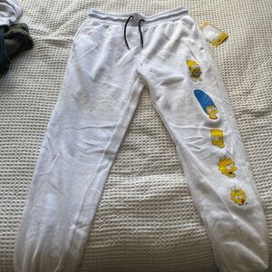 White joggers with Simpsons characters